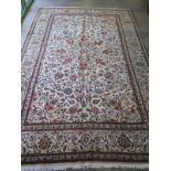 A hand knotted woolen Kashan rug - 3.08m x 2.05m