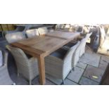 A Bramblecrest teak Batu dining table 220cm long with eight armchairs