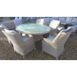 A Bramblecrest Oakridge outdoor elliptical dining table 220cm long 8 matching armchairs with