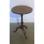 A Georgian mahogany side table with a 47cm circular top