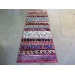 A hand knotted woolen Kilim and rug patches - 2.04m x 0.75m