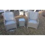 A pair of Bramblecrest Oakridge armchairs and a coffee table