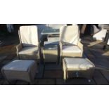 A pair of Bramblecrest all weather high back reclining armchairs, two footstools and a side table