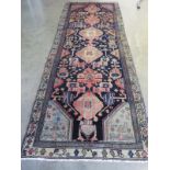 A hand knotted woolen Hamadan runner - 2.70m x 1.00m