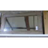 A rustic wooden framed mirror - 68cm x 119cm