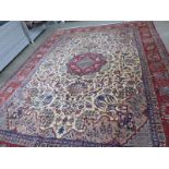 A hand knotted woolen Kashan rug - 4.50m x 3.12m