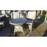 A pair of Bramblecrest Oakridge All Weather Wicker High Back Dining Armchair and a Bramblecrest