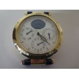 A Cartier chronograph table clock with moon phase day, date and hour dial numbered to back 8913