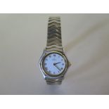 A ladies Ebel bi metal cased wristwatch with white dial with Roman numerals, stainless steel and