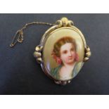 A gilt metal brooch with hand painted portrait of a young lady - Height 7cm x 6cm - repairs to