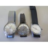 Three gentleman's manual wind wristwatches one in stainless steel case with bracelet strap, one in