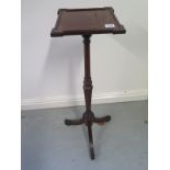 A mahogany plant stand