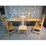 A good quality Arts and Crafts style ash dining table and eight matching dining chairs made by a