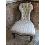 A 19th century mahogany nursing chair