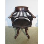 An early 1900's swivel desk office chair