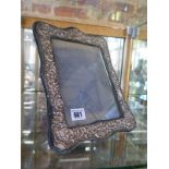 A silver picture/photo frame - 28cm x 22cm - some wear and denting to embossed silver