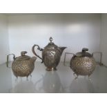 An Indian silver teapot - Height 15cm - and a small Indian silver teapot and a lidded bowl - total