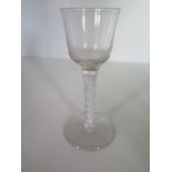 An 18th century cordial glass with bell shaped bowl and spiral twist stem - Height 15cm - one chip
