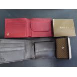 A Gucci wallet and key holder and a Rolex red leather wallet - all in good condition