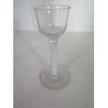 An 18th century cordial glass with bell shaped bowl and spiral twist stem - Height 14.5cm - small