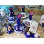 Four Wades Ceramic decanters containing Pussers Navy Rum all wax sealed with cork stoppers - two are