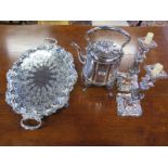 A pair of ornate Sheffield plate candlesticks and a plated tea kettle on stand with spirit burner