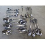 Four hallmarked fiddle back serving spoons and one plain, various hallmarked dessert spoons,