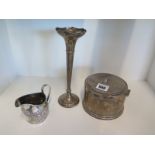 A silver lidded pot with weighted base, a silver jug and a silver vase with weighted base -