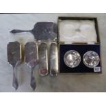 A pair of Indian silver bowls of pierced design, a silver hallmarked brush set and hand mirror -