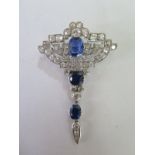 A good Art Deco sapphire and diamond brooch set with three sapphires surrounded by forty-eight