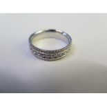 An 18ct white gold and diamond ring - size W - approx 9 grams - some minor usage marks, diamonds