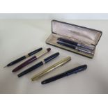 A selection of fountain pens including Sheaffers and a boxed set of gold nibbed platignum pen and