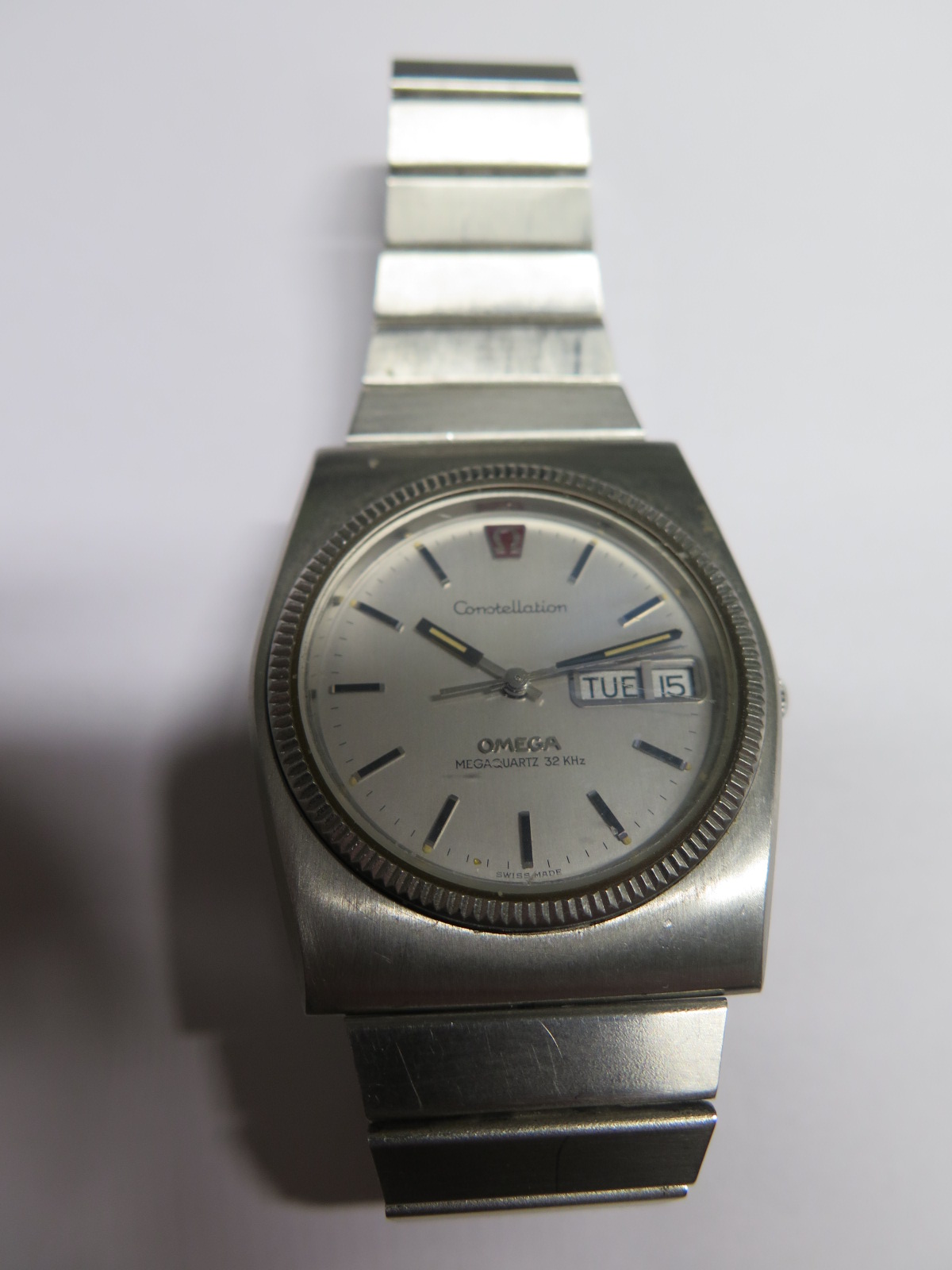A Gents Omega Constellation Quarts wristwatch with a medium sized strap in working order with a day,