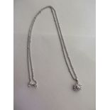 A 9ct white gold pendant set with baguette & brilliant cut diamonds - estimated total diamond weight