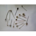 A collection of fifteen stick pins to include one 9ct pin and one 15ct pin and a plated locket -