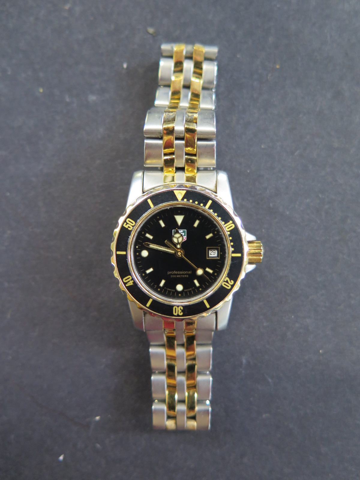A Tag Heuer ladies bi colour stainless steel professional quartz wristwatch with black bezel and