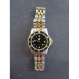 A Tag Heuer ladies bi colour stainless steel professional quartz wristwatch with black bezel and
