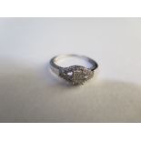 A silver diamond ring set - estimated total diamond weight 0.25ct - with gemology report - ring size