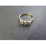 A 9ct yellow gold hallmarked three stone Diamond ring - size L - approx 2 grams, diamonds approx 0.