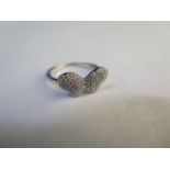 A silver diamond ring of stylised butterfly form - estimated total diamond weight 0.33cts - with