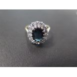 An 18ct yellow gold sapphire and diamond ring - The central sapphire approx 7.5mm x 9mm x 3.5mm