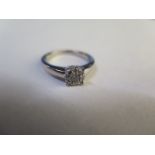 A silver diamond cluster ring - estimated total diamond weight 0.25cts with gemology report - as new