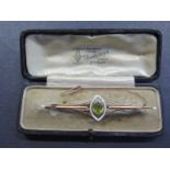 A yellow gold peridot enamel and pearl brooch, test to approx 9ct, - 8cm long approx 7.7 grams in