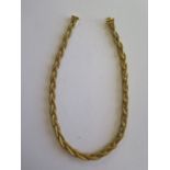 An 18ct yellow gold braided platted necklace with Egyptian hallmarks for 18ct and tested to 18ct