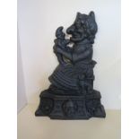 A cast iron Mr Punch door stop - 34cm tall