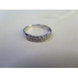 An 18ct white gold and diamond ring - size V/W - approx 5 grams set with eighteen diamonds - total