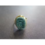 A yellow gold scarab ring size J/K - aprox 3.8 grams slight chipping to scarab otherwise good