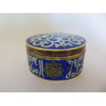 An Islamic enamel lidded pot - Height 5cm x 8cm diameter - overall good condition