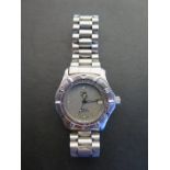 A Stainless steel Tag Heuer Quartz Professional wrist watch with date, 38mm wide - some usage marks,