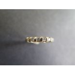 A 9ct yellow gold five stone diamond ring - size N, approx 2.2 grams - diamonds bright minor usage